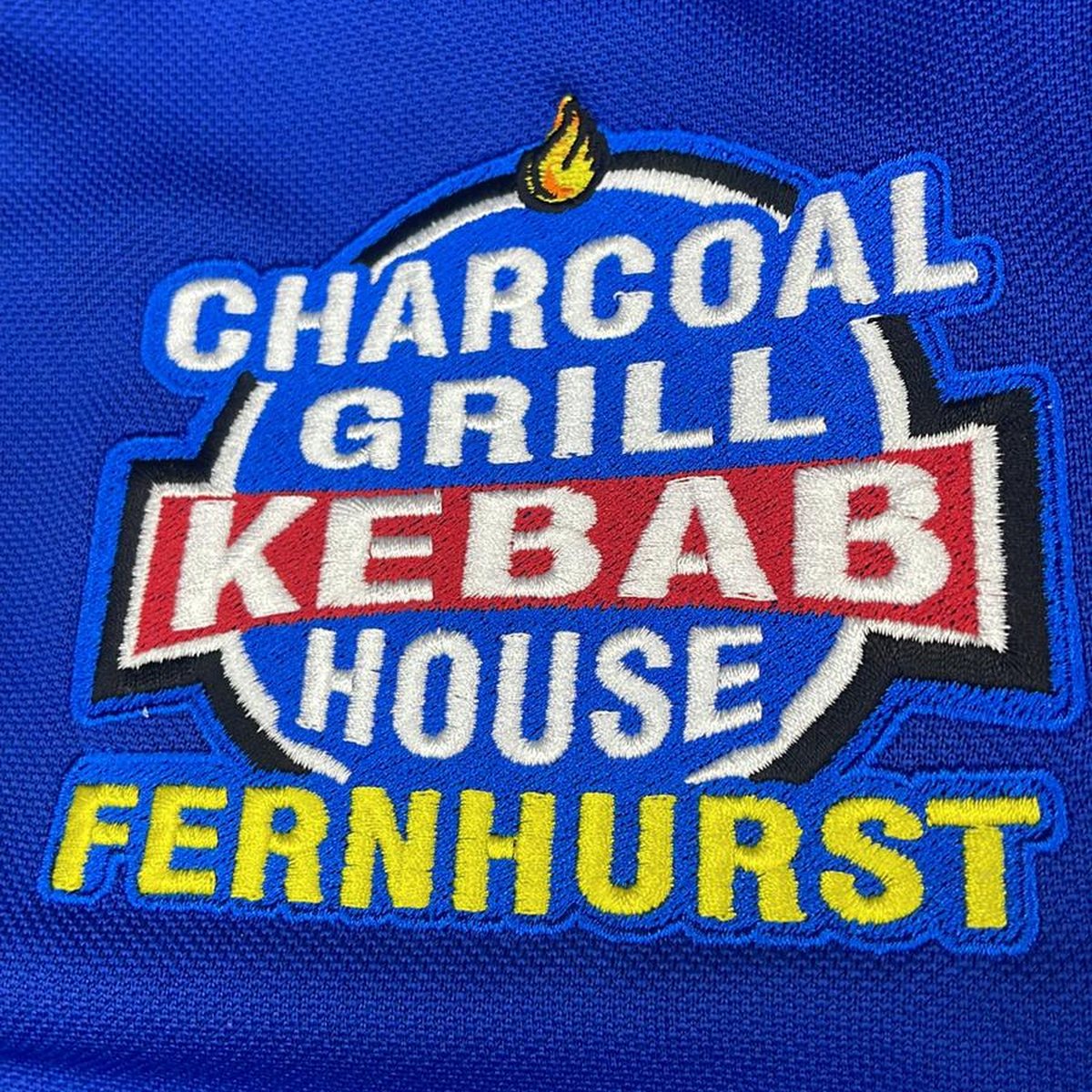 A layered badge for Charcoal Grill Kebab House