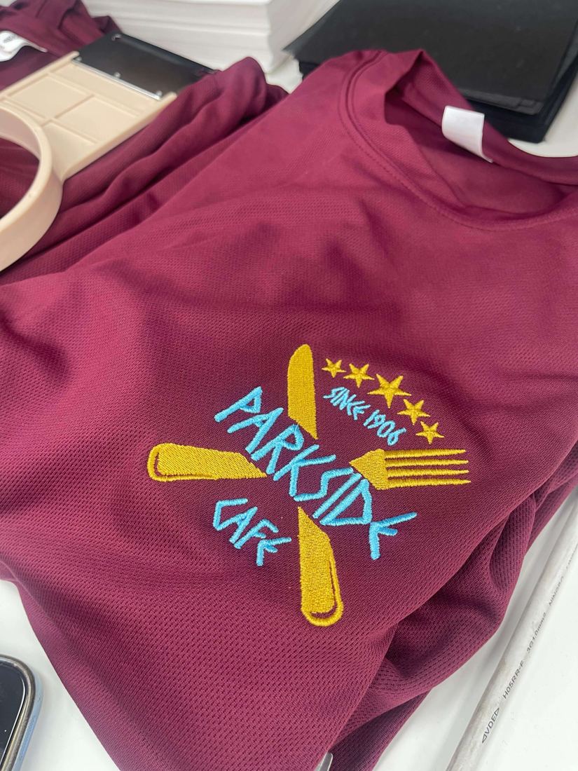 Folded embroidered polo shirts by Funtastic Uniform